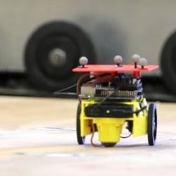 Small robot with wheels.