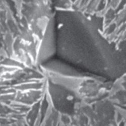 Microscopic view of an indent in a sample.
