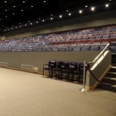 Inside the Performance Hall, showing the view of the middle aisle with usher seating and sound board